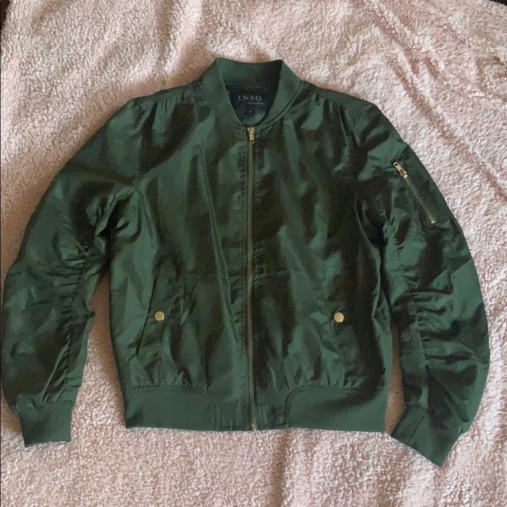 A green bomber jacket